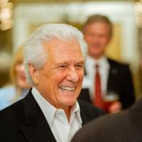 Ed Clark talking with guests at the Foundation Holiday Reception